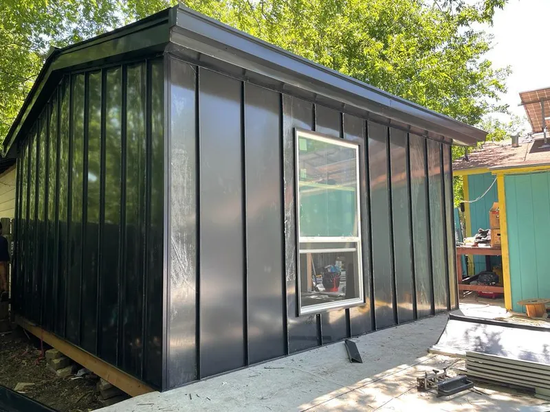 Black standing seam metal wall panels for Roof Inspection in Baker